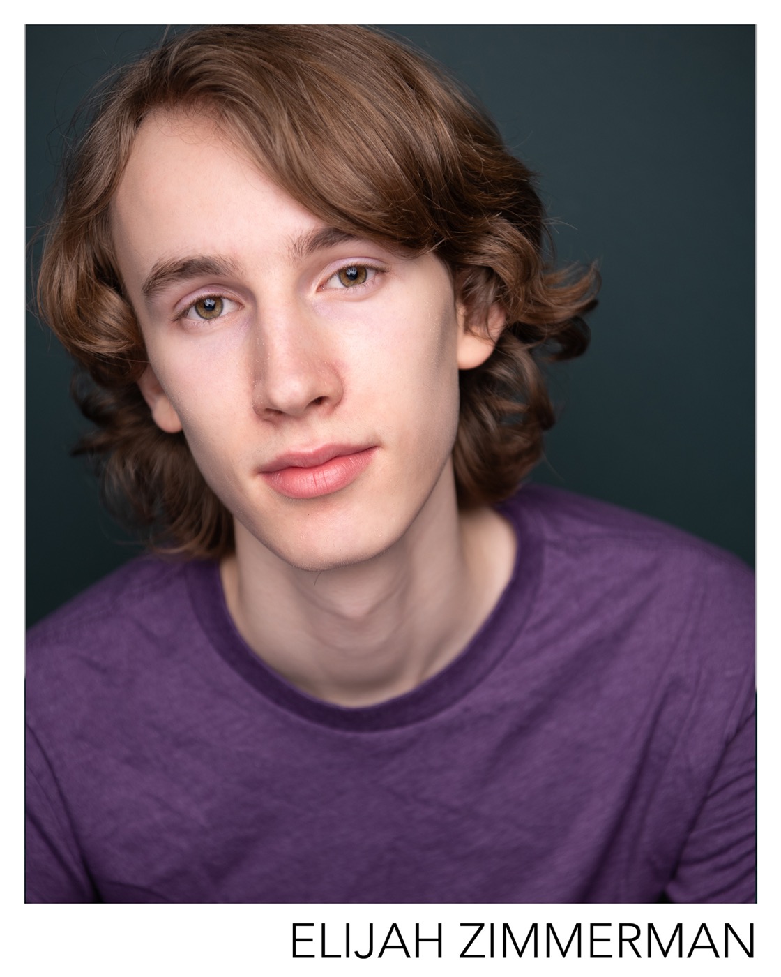 Elijah Zimmerman headshot — neutral, purple tee